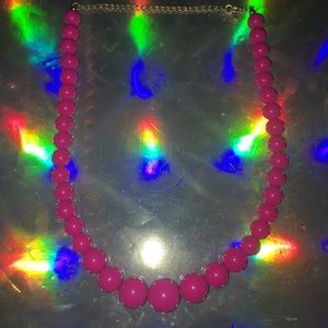Pink plastic bead necklace